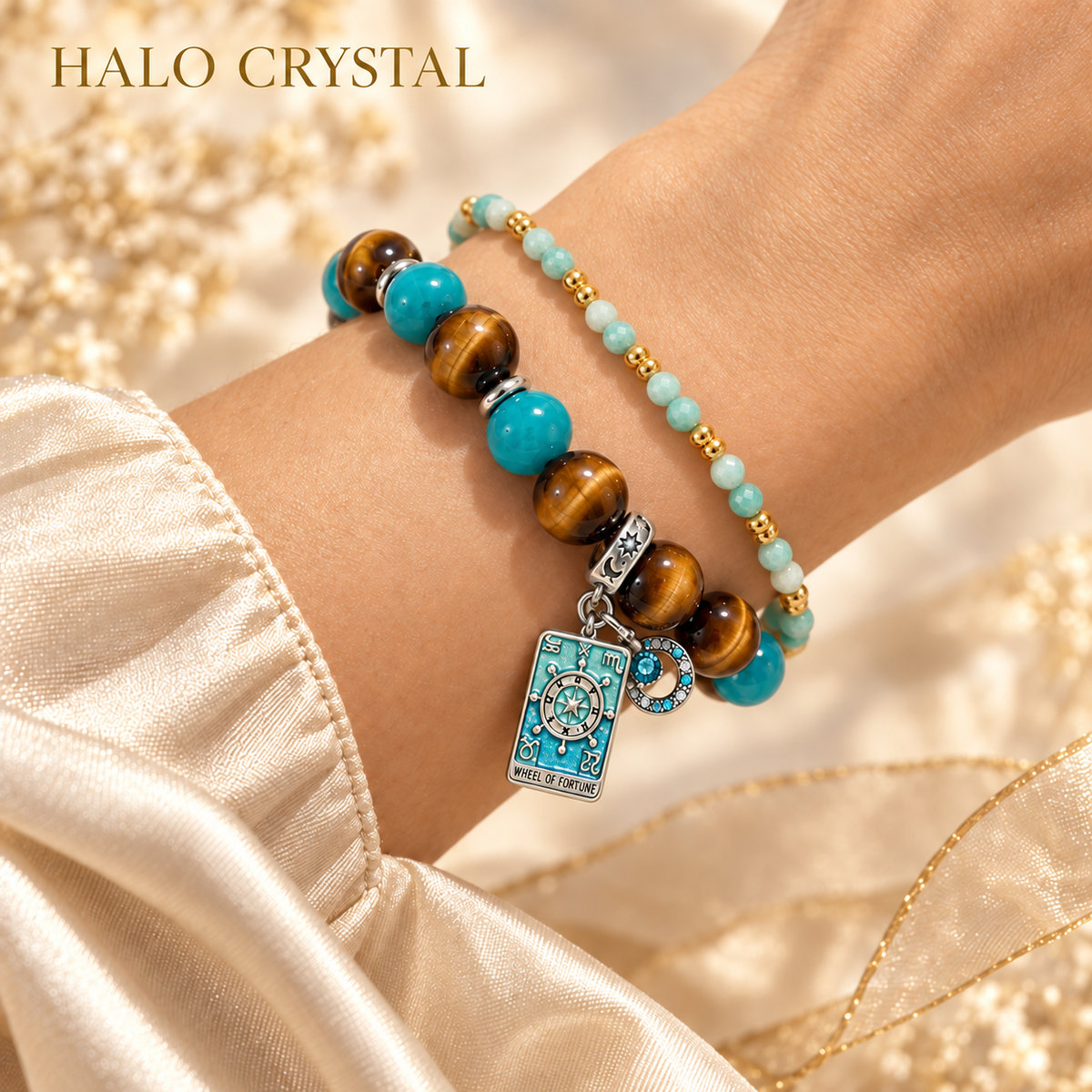 Wheel of Fortune tarot charm bracelet stacked with an amazonite faceted gemstone bracelet on wrist