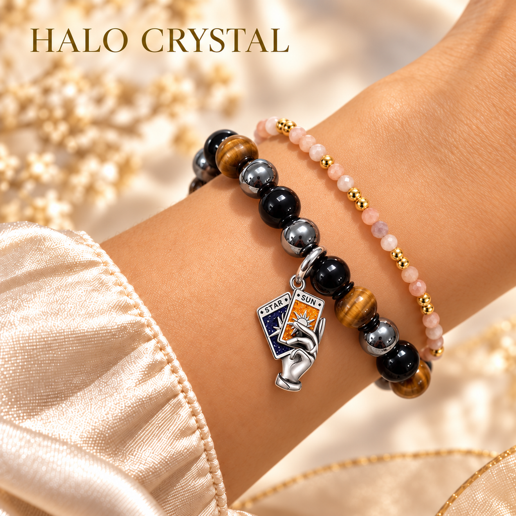 Sun and Star tarot charm bracelet in tiger eye, obsidian and hematite, stacked with a peach moonstone faceted bracelet on wrist